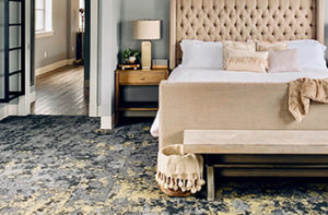 Bedroom-with-pattern-carpet-wtih-gray-gold-blue