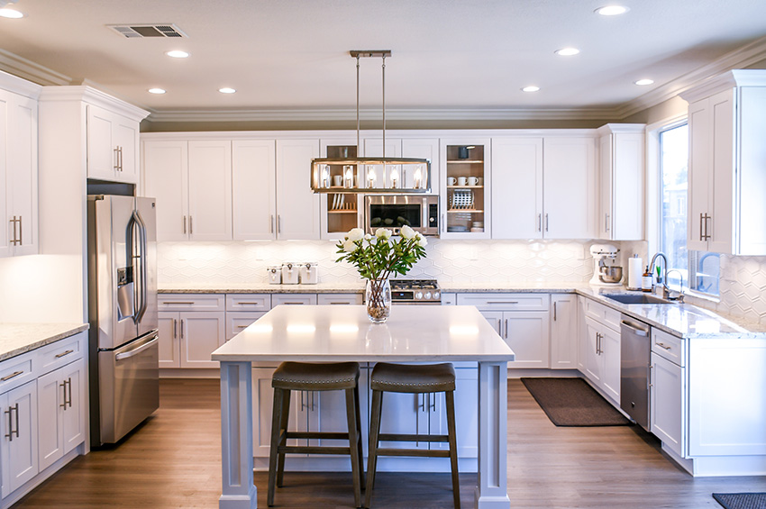 kitchen-with-white-cabinets-and-hardwood-flooring