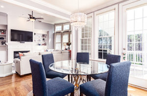 kitchen-with-small-table-blue-chairs-and-hardwood-floors