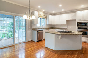 shiny-hardwood-floors-in-white-kitchen