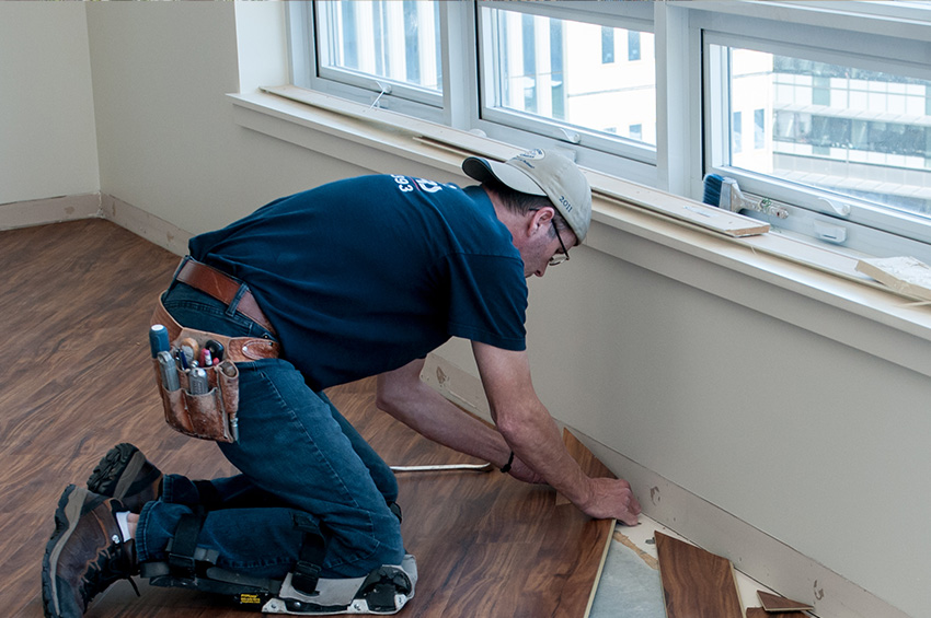 man-installing-hardwood-floors