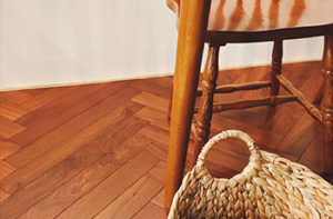 herringbone-hardwood-floors-with-basket-chair