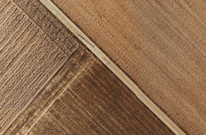 Close up of textured luxury vinyl tiles that look like wood.