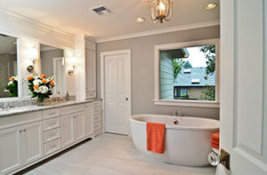 White luxury vinyl tile floors in newly remodeled bathroom with soaking tub.