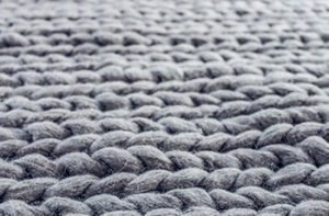 Closeup of a wool area rug.