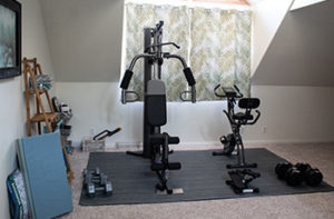 A howe gym showcases modern exercise equipment which is placed on a floor covered in carpet tiles