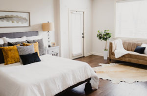 Rich mahogany wood-like looking laminate flooring in a guest bedroom