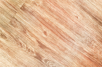 Light colored cork flooring that looks like hardwood.