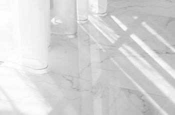 White, marble-look ceramic flooring materials.