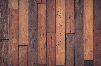 Close up of rustic hardwood flooring planks.